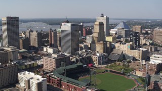DX0002_179_006 - 5.7K stock footage aerial video of flying toward tall office towers and a baseball stadium in Downtown Memphis, Tennessee