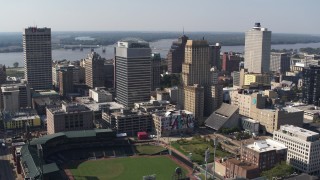 DX0002_179_007 - 5.7K stock footage aerial video of orbit two tall office towers and fly away for view of a baseball stadium in Downtown Memphis, Tennessee