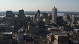 DX0002_180_004 - 5.7K stock footage aerial video focus on Lincoln American Tower while flying by office buildings in Downtown Memphis, Tennessee
