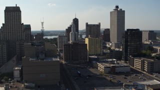 DX0002_180_006 - 5.7K stock footage aerial video focus on Lincoln American Tower, ascend past taller office buildings in Downtown Memphis, Tennessee