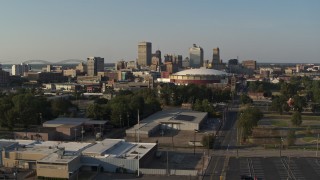 DX0002_180_027 - 5.7K aerial stock footage ascend toward the city skyline and FedEx Forum arena at sunset, Downtown Memphis, Tennessee