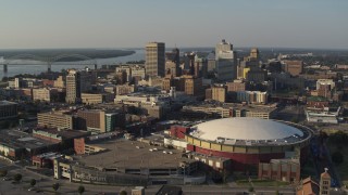 DX0002_180_030 - 5.7K aerial stock footage view of the city skyline from FedEx Forum arena at sunset, Downtown Memphis, Tennessee
