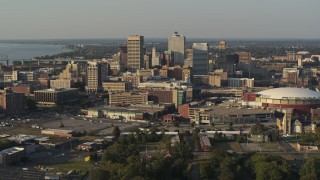 DX0002_180_035 - 5.7K aerial stock footage flying by the skyline and near FedEx Forum arena at sunset, Downtown Memphis, Tennessee