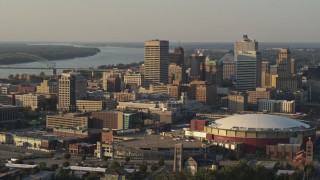 DX0002_181_007 - 5.7K aerial stock footage of approaching tall office towers and the arena at sunset, Downtown Memphis, Tennessee
