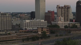 DX0002_181_034 - 5.7K aerial stock footage of approaching Memphis City Hall at sunset in Downtown Memphis, Tennessee