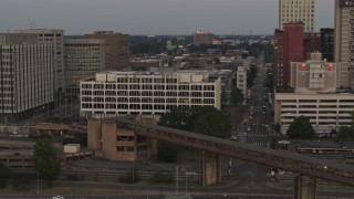 DX0002_181_035 - 5.7K aerial stock footage of orbiting Memphis City Hall at sunset in Downtown Memphis, Tennessee