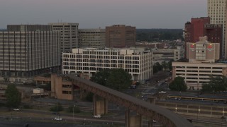 DX0002_181_036 - 5.7K aerial stock footage of orbit Memphis City Hall at sunset in Downtown Memphis, Tennessee