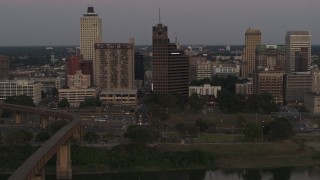 DX0002_181_039 - 5.7K aerial stock footage pass apartment and office high-rises at sunset in Downtown Memphis, Tennessee