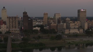 DX0002_181_041 - 5.7K aerial stock footage a view across the river at the skyline at sunset in Downtown Memphis, Tennessee