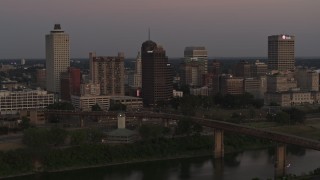 DX0002_181_042 - 5.7K aerial stock footage a view across the river at the city's skyline at sunset in Downtown Memphis, Tennessee