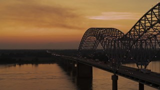 DX0002_181_044 - 5.7K aerial stock footage fly beside the Hernando de Soto Bridge at sunset, Arkansas