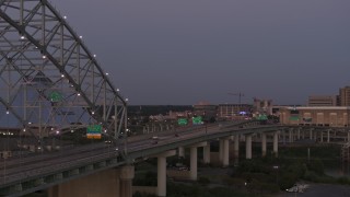 DX0002_181_047 - 5.7K aerial stock footage passing the Memphis side of the Hernando de Soto Bridge at twilight, Downtown Memphis, Tennessee