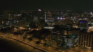 DX0002_182_029 - 5.7K aerial stock footage of the One Commerce Square office tower at night in Downtown Memphis, Tennessee