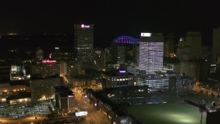 DX0002_182_032 - 5.7K aerial stock footage reverse view of One Commerce Square and First Tennessee Building at night in Downtown Memphis, Tennessee