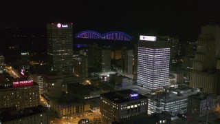DX0002_182_034 - 5.7K aerial stock footage fly away from One Commerce Square and First Tennessee Building at night in Downtown Memphis, Tennessee