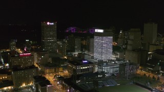 DX0002_182_036 - 5.7K aerial stock footage orbit and fly away from One Commerce Square and First Tennessee Building at night in Downtown Memphis, Tennessee