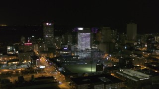 DX0002_182_037 - 5.7K aerial stock footage fly away from and approach One Commerce Square and First Tennessee Building at night in Downtown Memphis, Tennessee