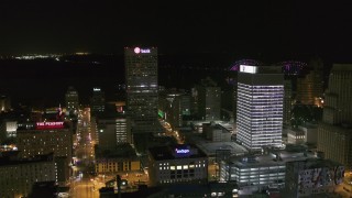 DX0002_182_038 - 5.7K aerial stock footage approach One Commerce Square by First Tennessee Building at night in Downtown Memphis, Tennessee