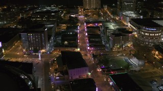 DX0002_182_039 - 5.7K aerial stock footage orbit intersection of Beale Street and BB King Boulevard at night in Downtown Memphis, Tennessee