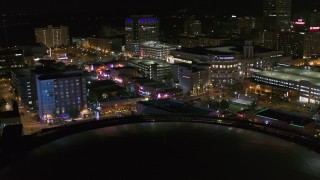 DX0002_182_040 - 5.7K aerial stock footage of restaurants and clubs on Beale Street at night in Downtown Memphis, Tennessee