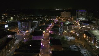 DX0002_182_041 - 5.7K aerial stock footage orbit restaurants and clubs on Beale Street at night in Downtown Memphis, Tennessee
