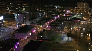DX0002_182_044 - 5.7K aerial stock footage reverse view of Beale Street and BB King Boulevard intersection at night in Downtown Memphis, Tennessee
