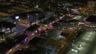 DX0002_182_048 - 5.7K aerial stock footage fly toward intersection of Beale Street and BB King Boulevard at night in Downtown Memphis, Tennessee