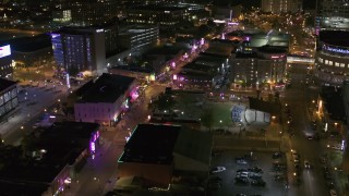 DX0002_182_049 - 5.7K aerial stock footage fly away from and past Beale Street and BB King Boulevard at night in Downtown Memphis, Tennessee