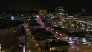 DX0002_182_051 - 5.7K aerial stock footage flyby FedEx Forum to reveal Beale Street clubs at night in Downtown Memphis, Tennessee
