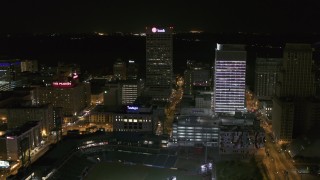 DX0002_182_054 - 5.7K aerial stock footage fly away from and orbit One Commerce Square and First Tennessee Building at night by Monroe Avenue, Downtown Memphis, Tennessee