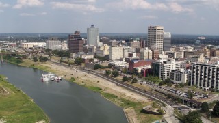 DX0002_183_017 - 5.7K aerial stock footage orbit office buildings and fly away from Downtown Memphis, Tennessee