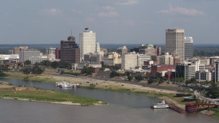 DX0002_183_025 - 5.7K aerial stock footage of orbiting city buildings between office towers, Downtown Memphis, Tennessee