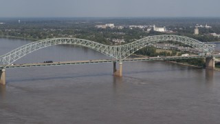 DX0002_183_027 - 5.7K aerial stock footage of traffic crossing the Hernando de Soto Bridge, Memphis, Tennessee