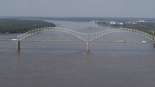 DX0002_183_029 - 5.7K aerial stock footage reverse view of the Hernando de Soto Bridge as traffic crosses the span, Memphis, Tennessee