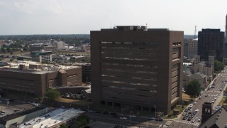 DX0002_184_005 - 5.7K aerial stock footage of flying away from the county courthouse in Downtown Memphis, Tennessee