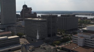 DX0002_184_010 - 5.7K aerial stock footage of an orbit of a county government building and police station in Downtown Memphis, Tennessee