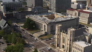DX0002_184_020 - 5.7K aerial stock footage fly away from courthouse, reveal church in Downtown Memphis, Tennessee