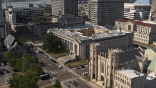 DX0002_184_021 - 5.7K aerial stock footage focus on courthouse while orbiting near the church in Downtown Memphis, Tennessee