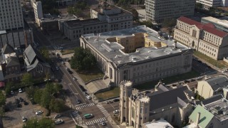 DX0002_184_024 - 5.7K aerial stock footage reverse view of courthouse by a church, Downtown Memphis, Tennessee
