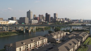 DX0002_185_003 - 5.7K aerial stock footage of the city's skyline and bridge seen from apartment buildings, Downtown Memphis, Tennessee