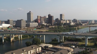 DX0002_185_004 - 5.7K aerial stock footage ascend from apartment buildings to focus on skyline, Downtown Memphis, Tennessee