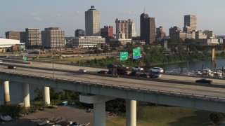 DX0002_185_013 - 5.7K aerial stock footage of traffic on the bridge near the skyline, Downtown Memphis, Tennessee
