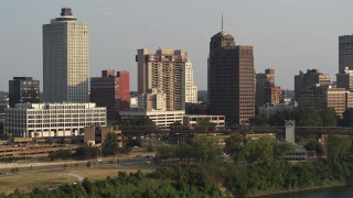 DX0002_185_035 - 5.7K aerial stock footage apartment complex and office high-rise at sunset, Downtown Memphis, Tennessee