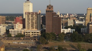 DX0002_185_037 - 5.7K aerial stock footage apartment complex and office high-rise at sunset, Downtown Memphis, Tennessee