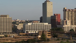 DX0002_185_040 - 5.7K aerial stock footage of orbiting Memphis City Hall at sunset, Downtown Memphis, Tennessee