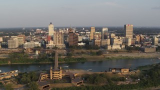 DX0002_186_004 - 5.7K aerial stock footage of a wide orbit around the downtown skyline at sunset, Downtown Memphis, Tennessee