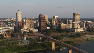 DX0002_186_008 - 5.7K aerial stock footage orbit downtown skyline at sunset, focus on apartment and office high-rises, Downtown Memphis, Tennessee