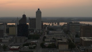 DX0002_186_037 - 5.7K aerial stock footage flyby office towers at sunset, with view of river and bridge, Downtown Memphis, Tennessee