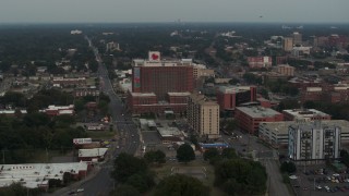 DX0002_186_041 - 5.7K aerial stock footage of orbiting a hospital at twilight in Memphis, Tennessee