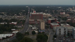 DX0002_186_042 - 5.7K aerial stock footage of slowly flying away from a hospital at twilight in Memphis, Tennessee